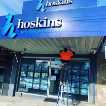Replacing a faulty LED floodlight at the front of store at Hoskins Real Estate