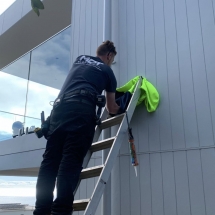 Fitting spotlight on an external wall