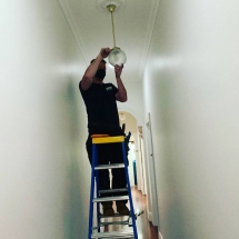 Fitting the final pendant at our Caulfield project