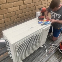 Wiring up of a split system air conditioner condenser on a roof 
